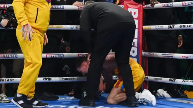 Paddy Donovan is consoled by his corner after being disqualified