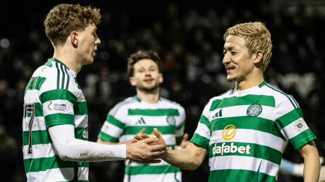 Celtic's Arne Engels celebrates with Daizen Maeda as he scores from the penalty spot to make it 2-1 during a William Hill Premiership match between St Mirren and Celtic at the SMiSA Stadium