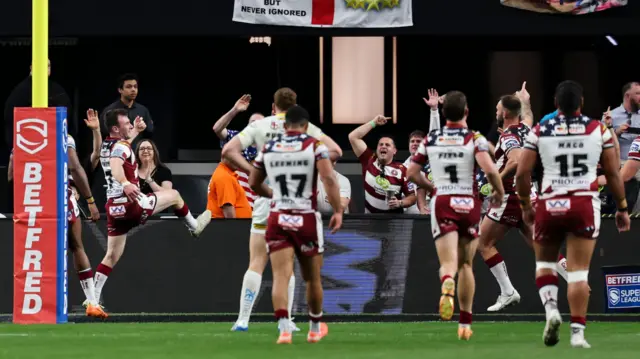 Harry Smith celebrates his try