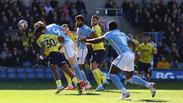 Jack Rudoni heads a goal for Coventry