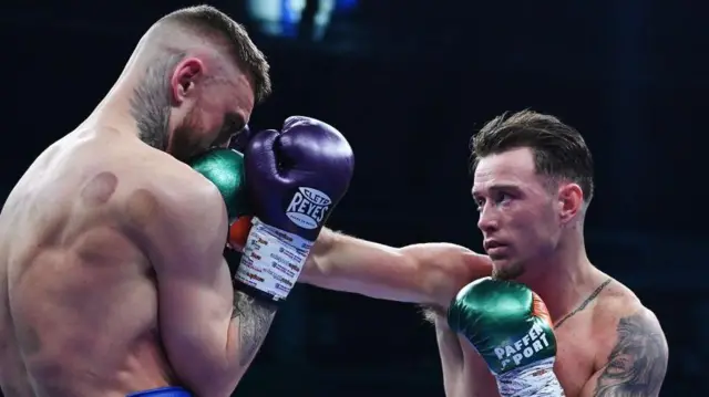 Lewis Crocker takes a punch from Paddy Donovan at the SSE Arena