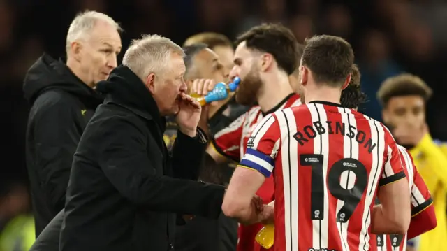 Chris Wilder talks to his Blades players