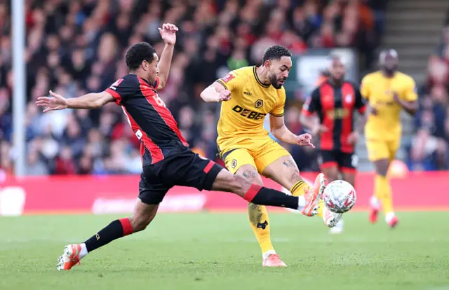 Matheus Cunha of Wolverhampton Wanderers is challenged by Tyler Adams