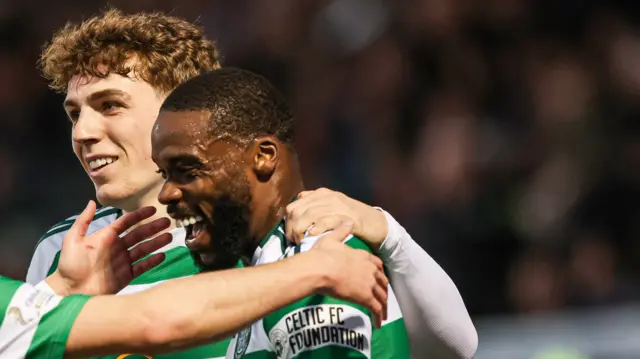 Celtic's Jeffrey Schlupp celebrates with Nicolas Kuhn and Arne Engels as he scores to make it 1-0 during a William Hill Premiership match between St Mirren and Celtic at the SMiSA Stadium