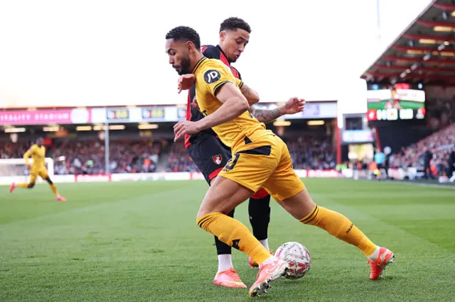 Matheus Cunha of Wolverhampton Wanderers is challenged by Marcus Tavernier