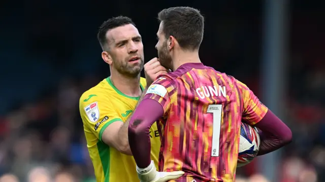 Shane Duffy checks on Angus Gunn's face following a collision