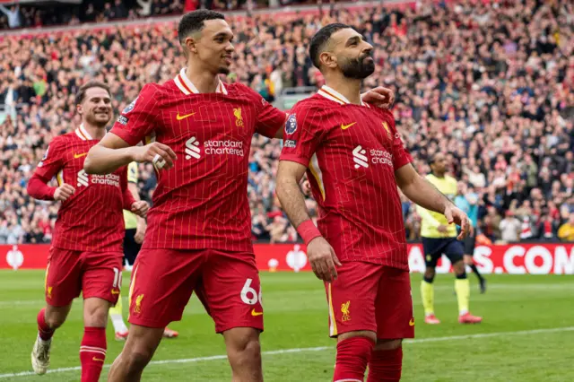 Mohamed Salah celebrates with Trent Alexander-Arnold