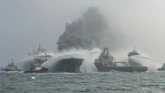 Fire and rescue services attend after a collision between oil tanker MV Stena Immaculate and the cargo vessel MV Solong