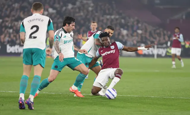 West Ham United's Mohammed Kudus is challenged by Newcastle United's Sandro Tonali