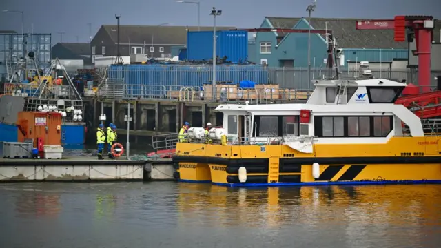 Emergency services at Grimsby Docks following oil tanker and cargo vessel crash in the Humber Estuary.