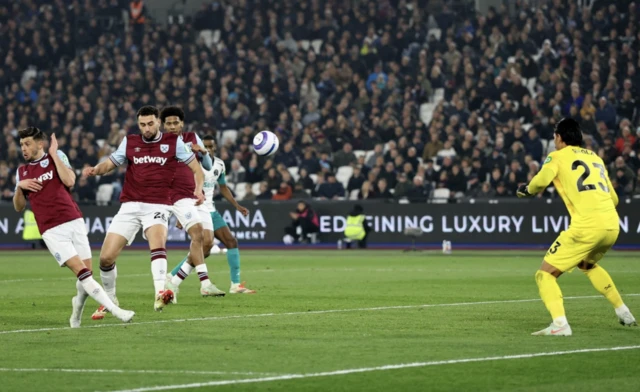 West Ham United's Alphonse Areola saves from West Ham United's Max Kilman