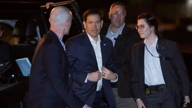 U.S. Secretary of State Marco Rubio boards a plane prior to departure from Homestead Air Reserve Base in Homestead, Florida, U.S