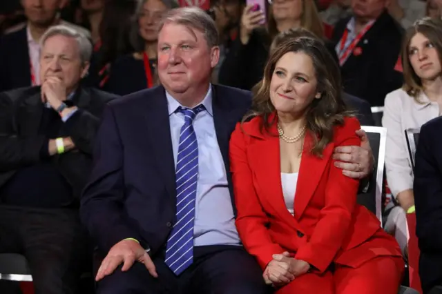 Chrystia Freeland sits with her husband Graham Bowley at the leadership event