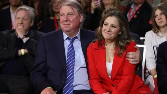 Chrystia Freeland sits with her husband Graham Bowley at the leadership event
