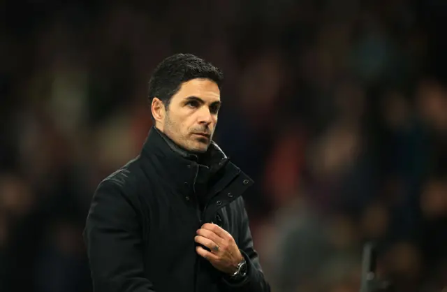 Mikel Arteta looks on