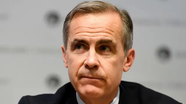 A close-up shot of Mark Carney as he looks to his right.