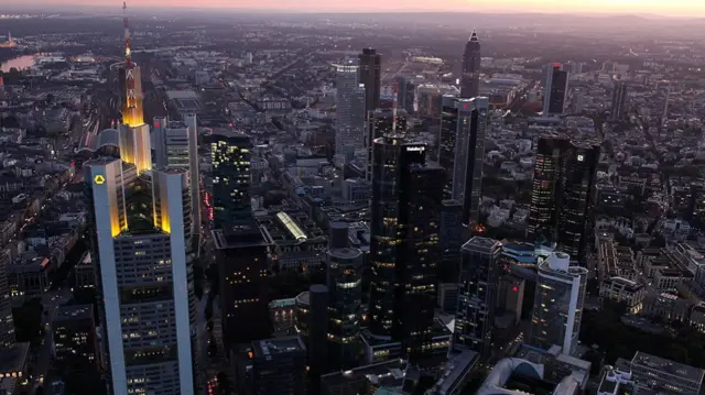 Commerzbank Tower lit up late evening.