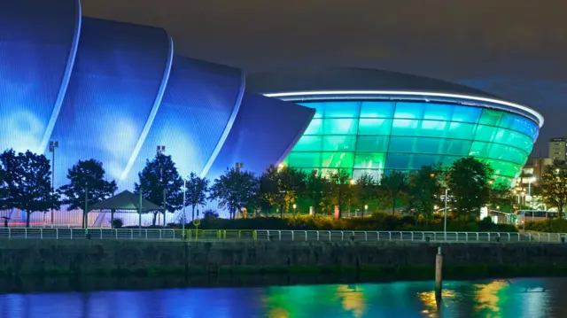 SSE Hydro now called OVO Hydro lit up at night.