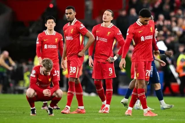 Liverpool's players react at the end of the last 16 second leg UEFA Champions League football match between Liverpool and Paris Saint-Germain.