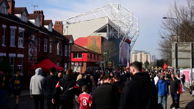 A general view of Manchester United fans walking to Old Trafford