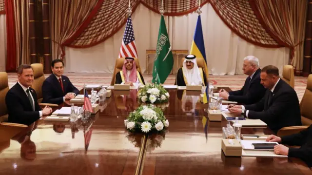 (L-R) U.S. National Security Advisor Mike Waltz, U.S. Secretary of State Marco Rubio, Saudi Foreign Minister Faisal bin Farhan and National Security Advisor Mosaad bin Mohammad al-Aiban, Ukrainian Foreign Minister Andrii Sybiha, Ukrainian Head of Presidential Office Andriy Yermak and Ukrainian Minister of Defense Rustem Umerovto attend a meeting between the US and Ukraine hosted by the Saudis on March 11, 2025 in Jeddah, Saudi Arabia