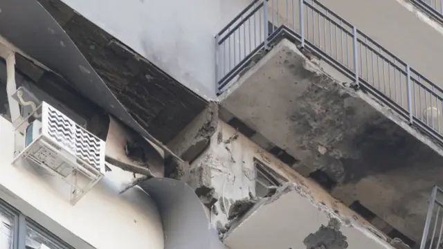 A damaged apartment building following a drone attack in the village of Sapronovo in the Moscow region.