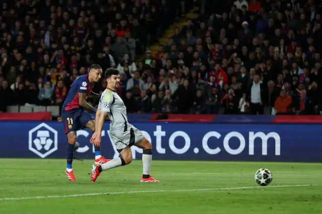 Raphinha of FC Barcelona scores his team's third goal.