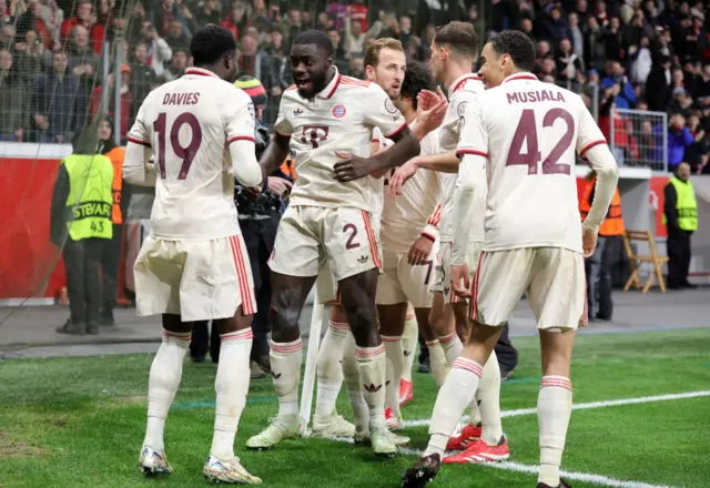 Alphonso Davies of Bayern Muenchen celebrates.