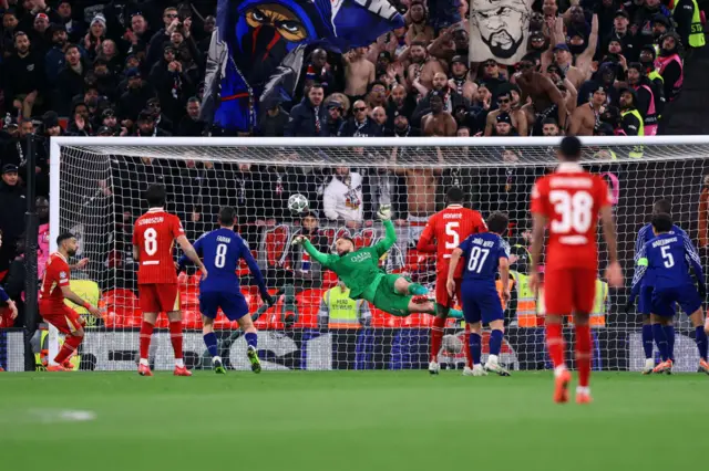 Paris Saint-Germain goalkeeper Gianluigi Donnarumma makes a dramatic save.