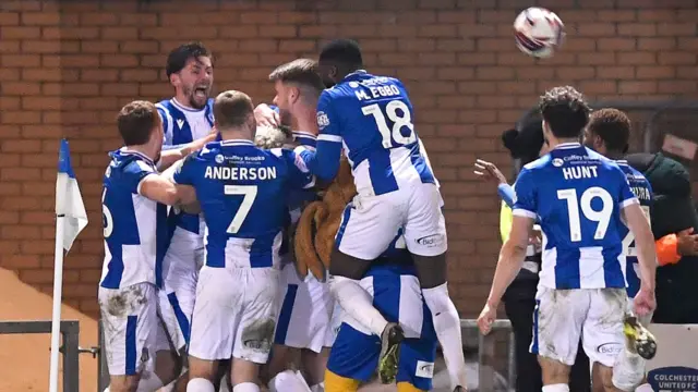 Colchester United players celebrate