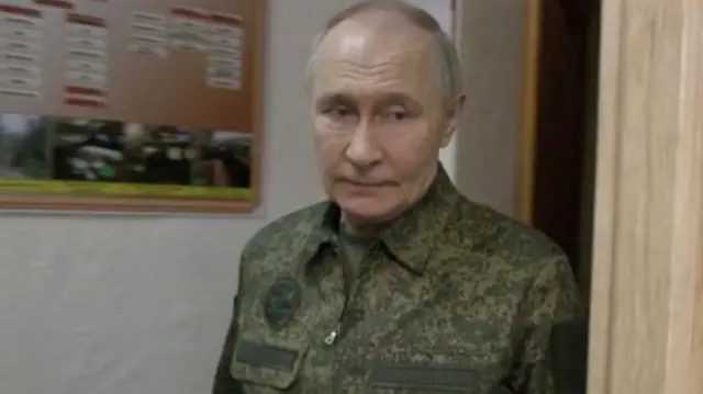 Vladimir Putin wearing military clothing