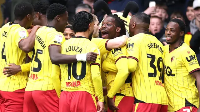 Watford players celebrate a goal in their most recent win over Luton Town