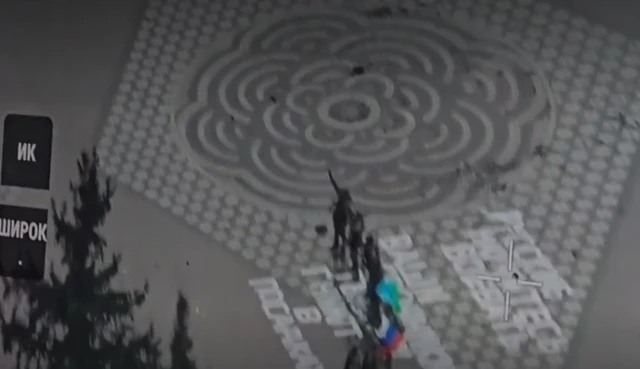 Drone footage over the central park in Sudzha showed men waving a Russian flag