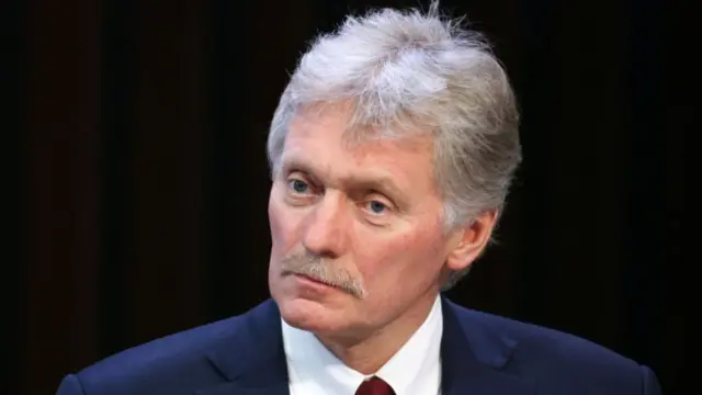 In this pool photograph distributed by the Russian state agency Sputnik, Kremlin spokesman Dmitry Peskov attends Russia's President Vladimir Putin's annual end-of-year press conference in Moscow on December 19, 2024