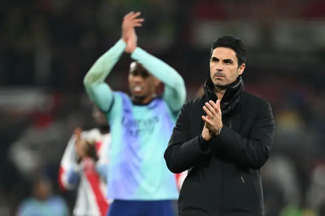 Mikel Arteta claps the away fans at Old Trafford
