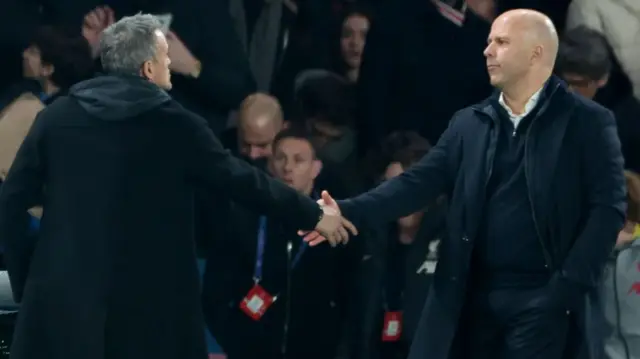 Luis Enrique and Arne Slot shake hands