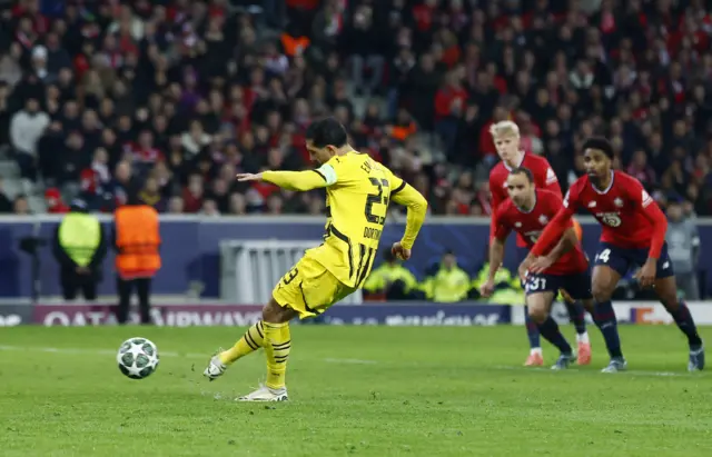 Borussia Dortmund's Emre Can scores their first goal.