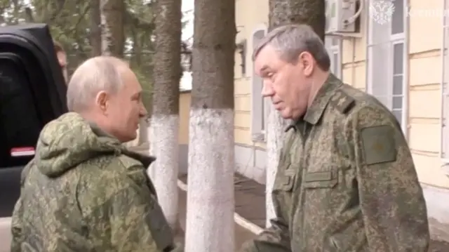 Putin shakes hands with Chief of the General Staff of Russian Armed Forces Valery Gerasimov