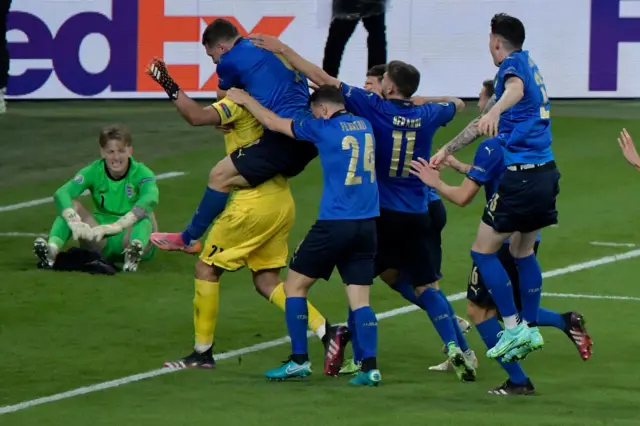 Gianluigi Donnarumma celebrates with Italy team-mates