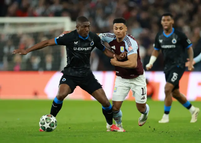 Aston Villa's Ollie Watkins in action with Club Brugge's Joel Ordonez.