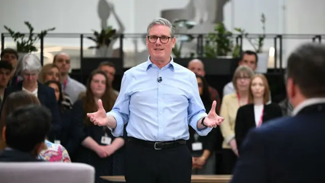 Prime Minister Keir Starmer gestures during a Q&A session.