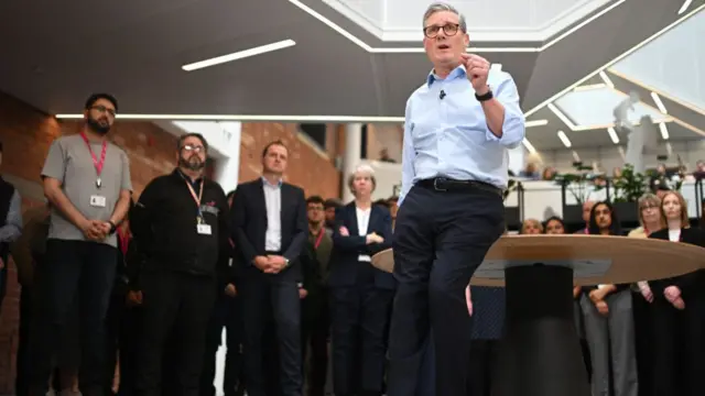 Prime Minister Keir Starmer gestures during a Q&A session.