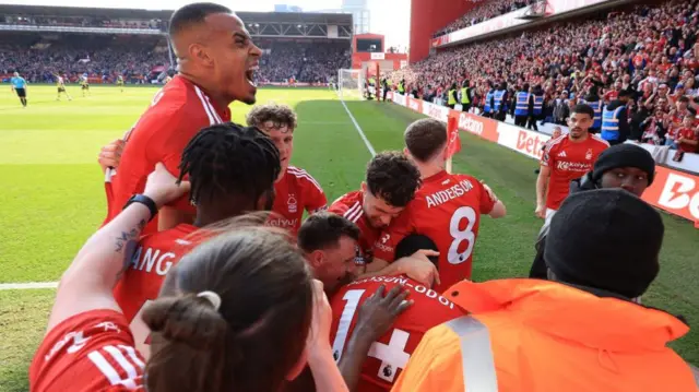 Nottingham Forest players celebrating in front of the fans.