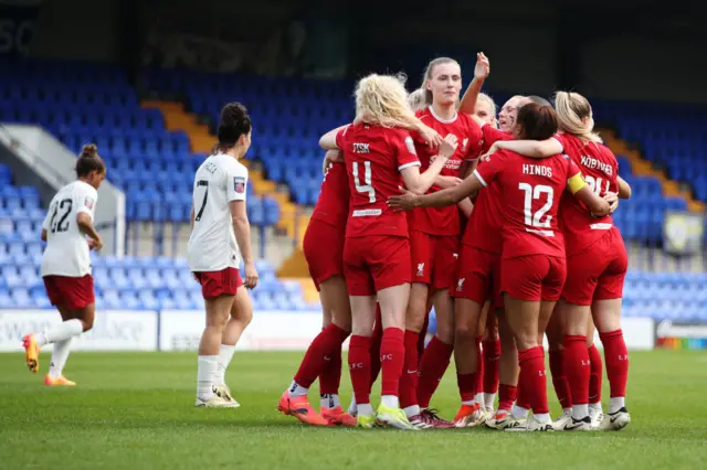 enna Clark of Liverpool celebrates with teammates after scoring her team's first goal during the Barclays Women´s Super League match between Liverpool FC and Manchester United