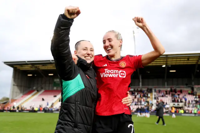 Millie Turner and Leah Galton both celebrate.