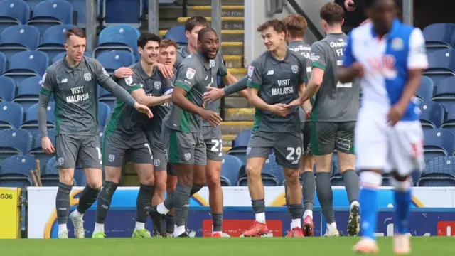 Cardiff players celebrate after Yakou Meite's goal at Blackburn