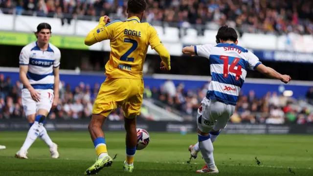 QPR's Koki Saito bends his shot into the far corner of the net