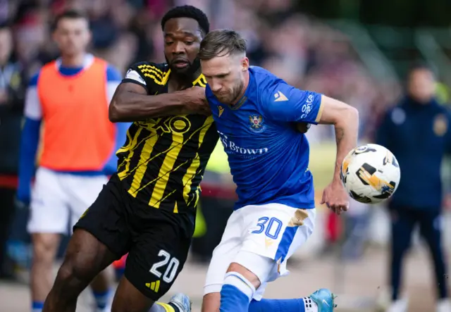 Aberdeen's Shayden Morris and St. Johnstone's Barry Douglas in action