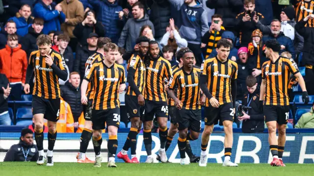 Hull players celebrate Abu Kamara's equaliser at West Brom