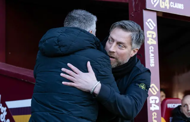 Michael Wimmer embraces Stephen Robinson